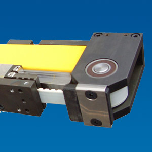 Toothed belt axis with integrated re-circulating ball bearing guide